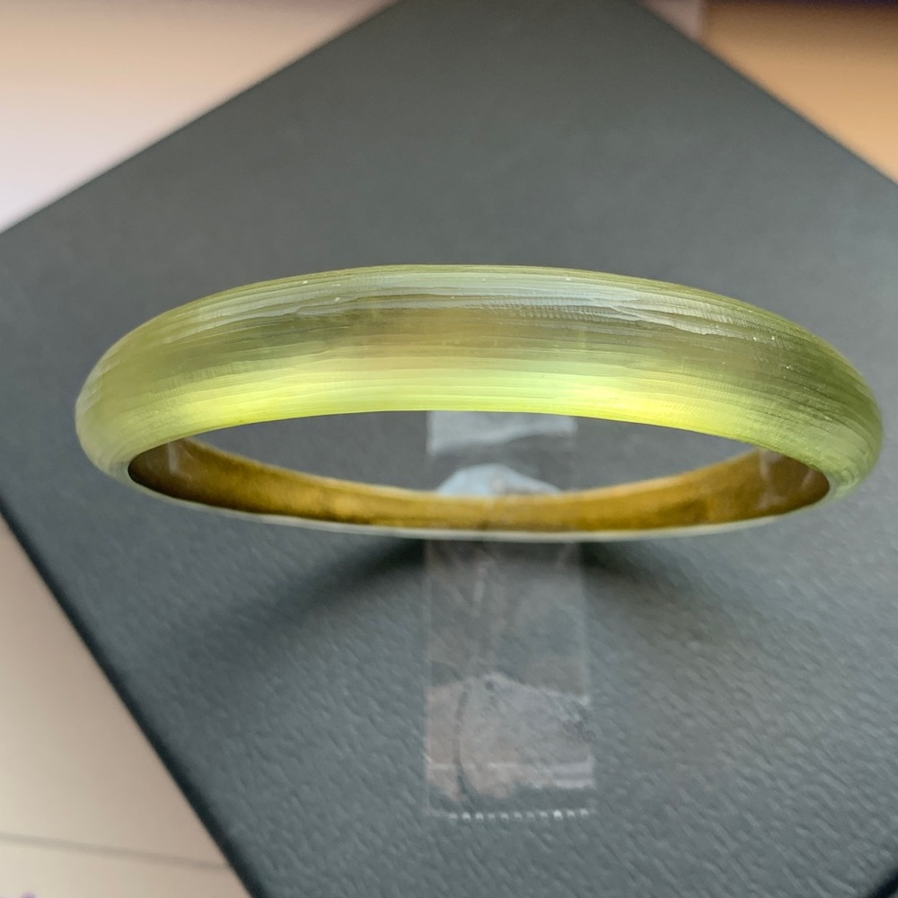 Alexis Bittar tapered bangle bracelet.
